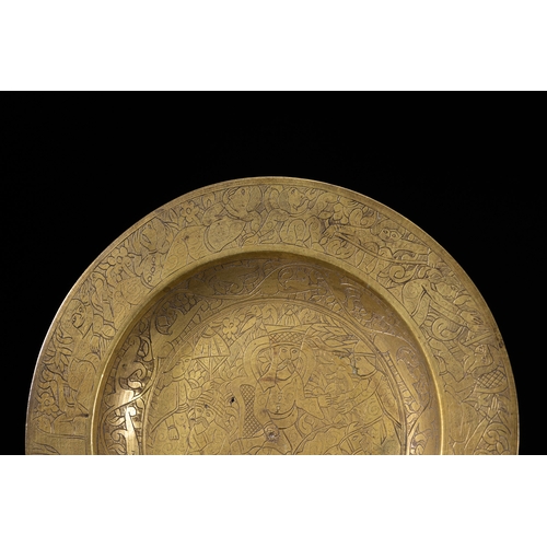 43 - A Qajar Brass Charger Dish with Figural Hunting Scene, 19th-20th Century.

A circular Qajar brass ch... 