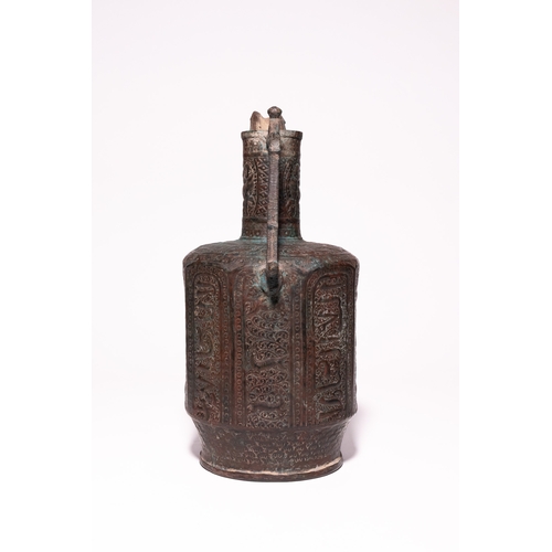 44 - An Islamic Bronze Faceted Ewer with Zoomorphic Panels, 12th Century.

A bronze ewer of faceted balus... 