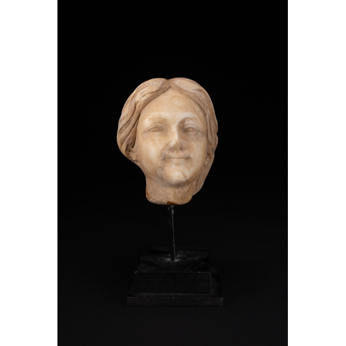 7 - A Roman Style Carved Marble Female Head Fragment.

A carved marble head fragment depicting a female ... 