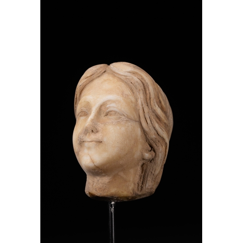 7 - A Roman Style Carved Marble Female Head Fragment.

A carved marble head fragment depicting a female ... 