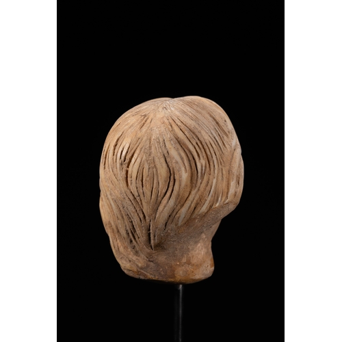 7 - A Roman Style Carved Marble Female Head Fragment.

A carved marble head fragment depicting a female ... 
