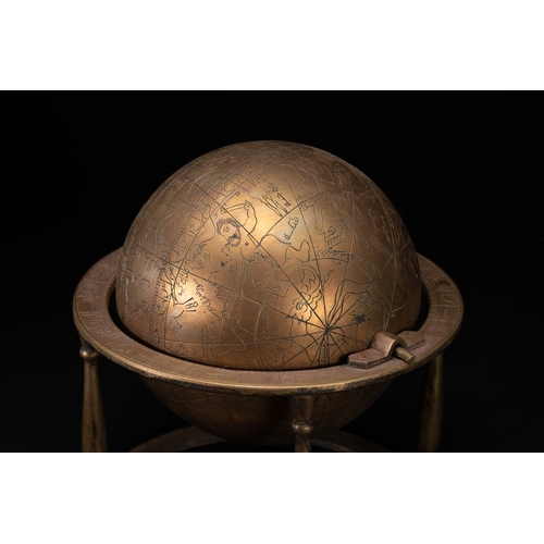55 - An Islamic Brass Celestial Globe on Stand with Engraved Zodiac and Script.

An Islamic brass celesti... 
