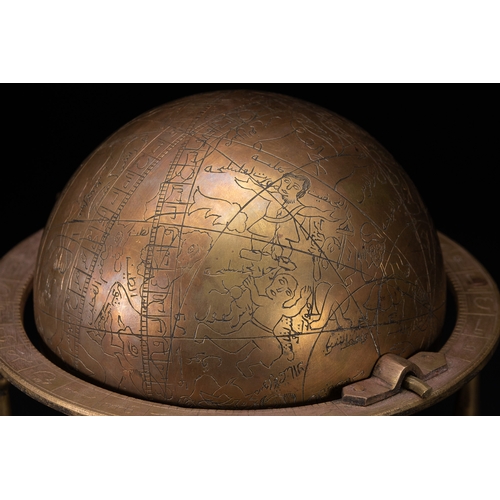 55 - An Islamic Brass Celestial Globe on Stand with Engraved Zodiac and Script.

An Islamic brass celesti... 