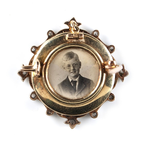 169 - A diamond & pale blue guilloche enamel pendant brooch, with portrait photograph to reverse, 1.1ins. ... 