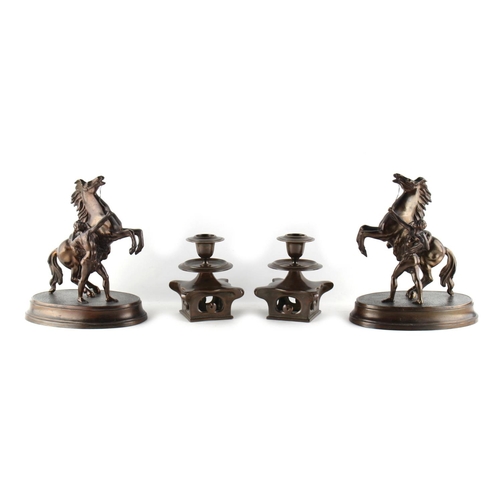 18 - Property of a gentleman - a pair of Japanese bronze candlesticks, 4.95ins. (12.5cms.) high; together... 