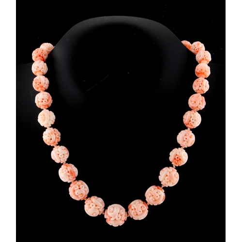 190 - A Chinese carved coral graduated bead necklace, the largest bead approximately 18.5mm diameter, indi... 