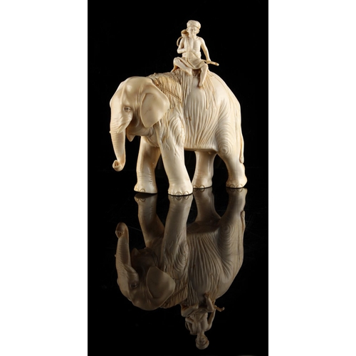 22 - Property of a gentleman - a Japanese carved ivory okimono modelled as a standing elephant with rider... 