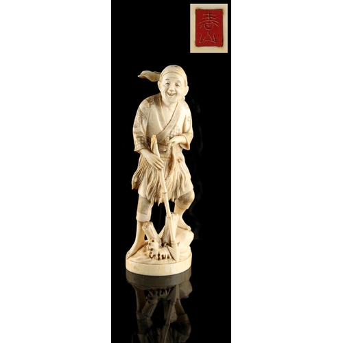 24 - Property of a lady - a Japanese carved ivory okimono depicting a fisherman harpoonist, loss to top o... 