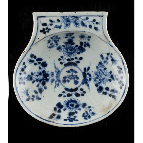 248 - A Chinese blue & white scallop shell shaped dish, 17th / 18th century, 6.4ins. (16.2cms.) wide (see ... 