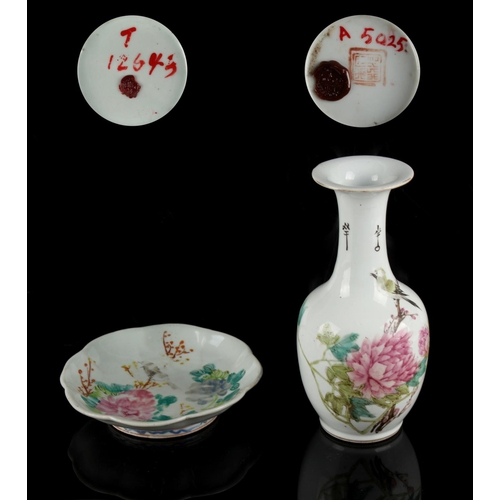 251 - A Chinese famille rose bottle vase depicting a bird among peonies, 20th century, 8.6ins. (21.8cms.) ... 