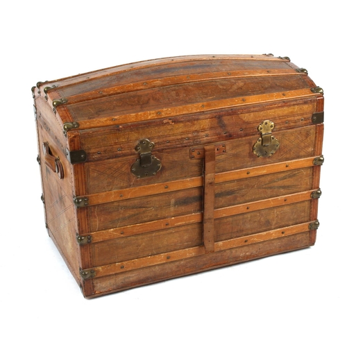 41 - Property of a deceased estate - a late 19th century tooled leather domed top trunk with fitted inter... 