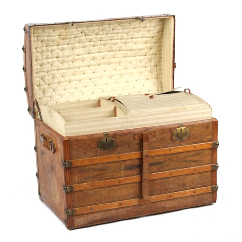 41 - Property of a deceased estate - a late 19th century tooled leather domed top trunk with fitted inter... 