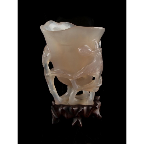 469 - Property of a lady - an early 20th century Chinese carved agate libation cup, of even greyish colour... 