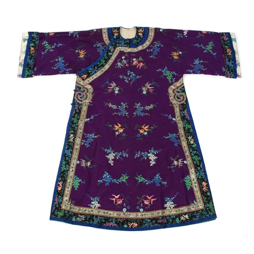 479 - Property of a lady - a late 19th / early 20th century Chinese embroidered silk long robe decorated w... 