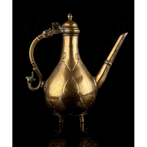 48 - Property of a gentleman - an Islamic bronze ewer, 18th / 19th century, with engraved floral decorati... 