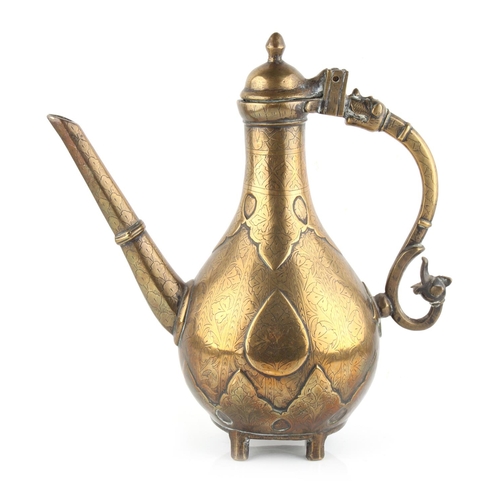 48 - Property of a gentleman - an Islamic bronze ewer, 18th / 19th century, with engraved floral decorati... 