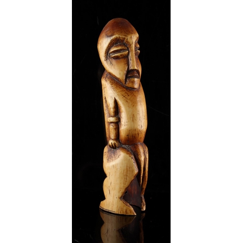 57 - Property of a gentleman - an African tribal carved ivory figure of a standing man, probably Lega, ea... 