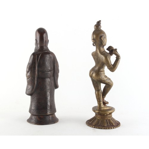 128 - Property of a deceased estate - an Indian bronze figure of Krishna, 19th century, modelled standing ... 