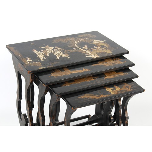 218 - Property of a lady - a quartetto nest of four chinoiserie decorated black lacquered occasional table... 