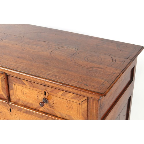 155 - Property of a lady - a late 17th / early 18th century oak & fruitwood chest of two short & three lon... 