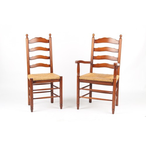 168 - Property of a lady - a set of six reproduction rush seated ladder-back chairs including two carvers ... 