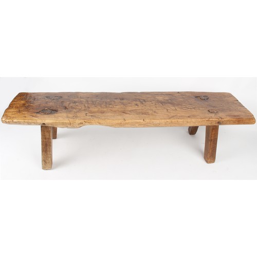 178 - Property of a gentleman - a large antique elm pig bench, of good colour, 73ins. (185cms.) long.