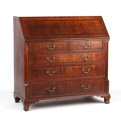 154 - Property of a lady - an 18th century George III oak & mahogany banded fall-front bureau, with fitted... 