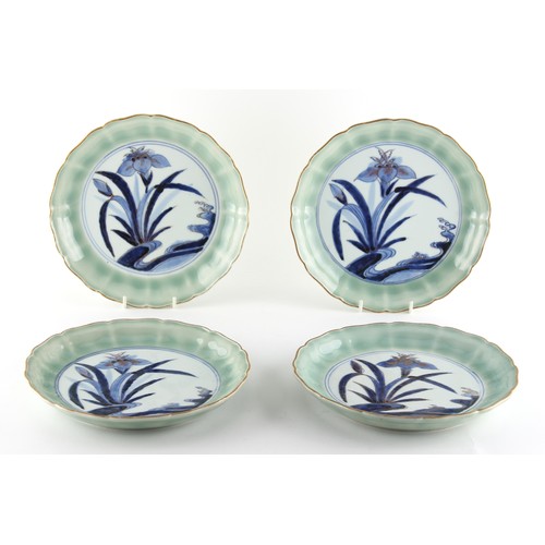 218 - Property of a lady - a set of four Japanese Arita blue and white & celadon shallow dishes, 18th / 19... 