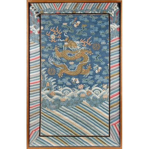 161A - A 19th century Chinese kesi panel depicting a dragon chasing a flaming pearl above waves, approximat... 