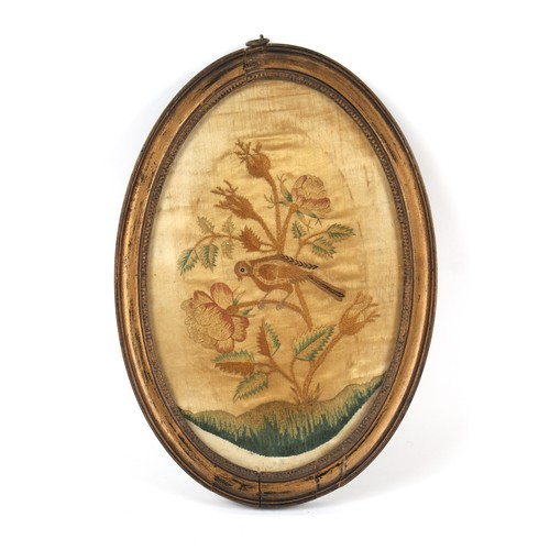 330 - Property of a gentleman - a 19th century silkwork oval picture depicting a bird & flower, in glazed ... 