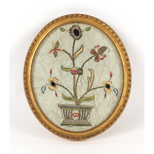 333 - Property of a gentleman - a 19th century silkwork & metal thread oval picture depicting flowers in a... 