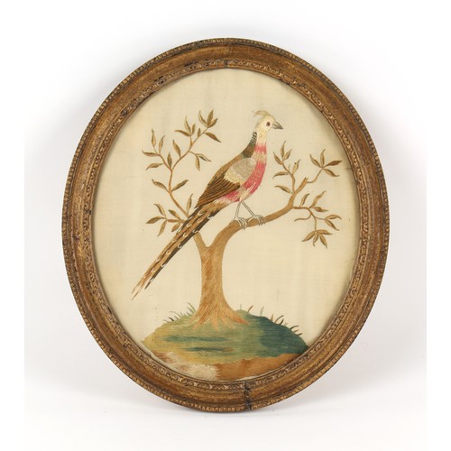 334 - Property of a gentleman - a 19th century silkwork oval picture depicting a bird perched in a shrub, ... 