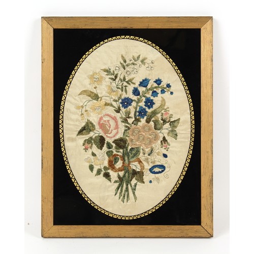 345 - Property of a gentleman - a 19th century silkwork oval picture depicting a bouquet of flowers, in gi... 