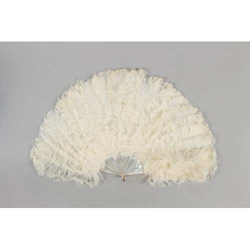 311 - Property of a gentleman - a late 19th / early 20th century mother-of-pearl & white ostrich feather f... 