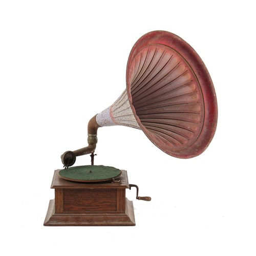 483 - Property of a deceased estate - an early 20th century oak cased wind-up gramophone with tin horn.