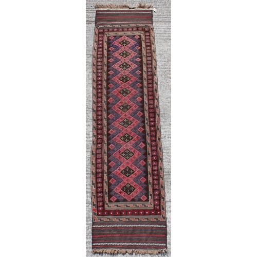 372 - Property of a lady - an Afghan runner with kelim ends, 107 by 26ins. (272 by 66cms.).