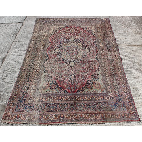 367A - Property of a gentleman - an antique Kirman carpet, worn, 168 by 112ins. (427 by 285cms.).