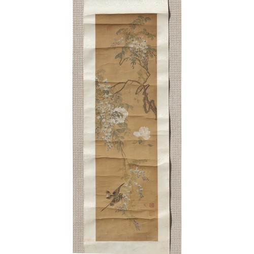 139 - A late 19th / early 20th century Chinese scroll painting on silk depicting two birds among blossomin... 