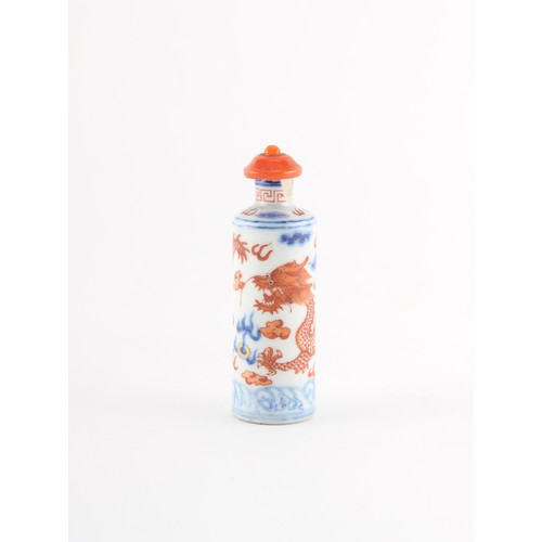 81 - Property of a lady - a Chinese iron red & blue & white snuff bottle painted with a dragon, underglaz... 