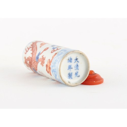 81 - Property of a lady - a Chinese iron red & blue & white snuff bottle painted with a dragon, underglaz... 