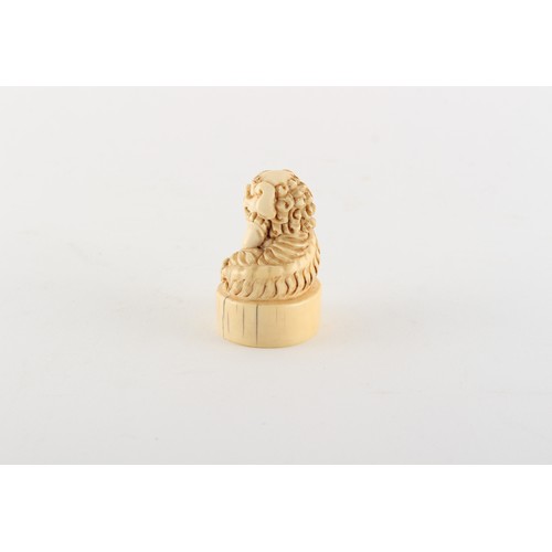 170 - Property of a gentleman - a Chinese carved ivory chop seal modelled as a seated Buddhistic lion, lat... 