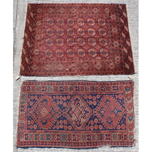 370 - Property of a lady - a Turkoman rug with four rows of octagonal guls, 55 by 43ins. (140 by 109cms.);... 