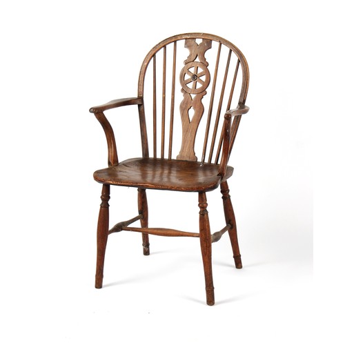 451 - Property of a lady - a 19th century fruitwood Windsor wheel-back elbow chair, with turned legs & str... 