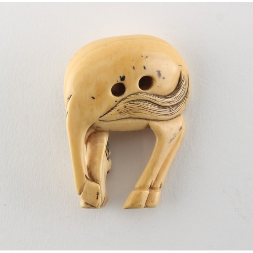 224 - Property of a gentleman - a Japanese carved ivory netsuke modelled as a grazing horse, 18th / 19th c... 