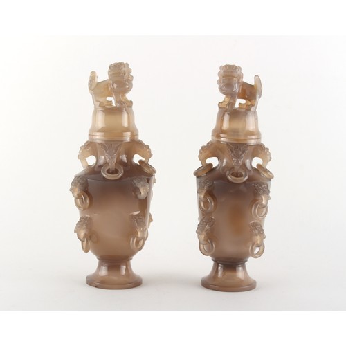 106 - A pair of Chinese carved grey agate vases & covers, with temple lion finials & ring handles, each 7.... 