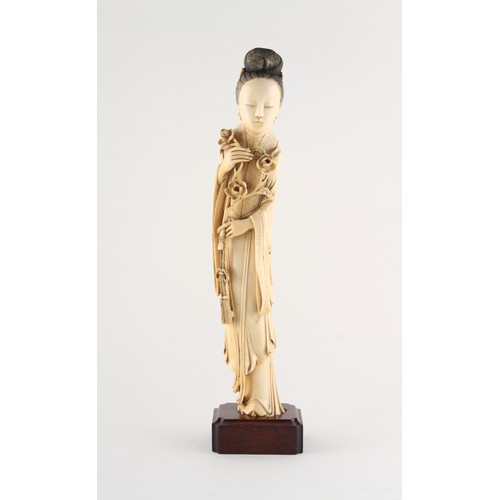 151 - Property of a gentleman - a Chinese carved ivory figure of a lady in flowing robes, 19th century, mo... 