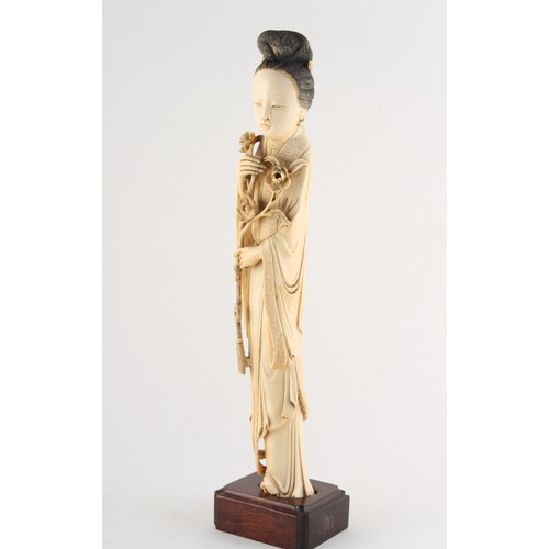 151 - Property of a gentleman - a Chinese carved ivory figure of a lady in flowing robes, 19th century, mo... 