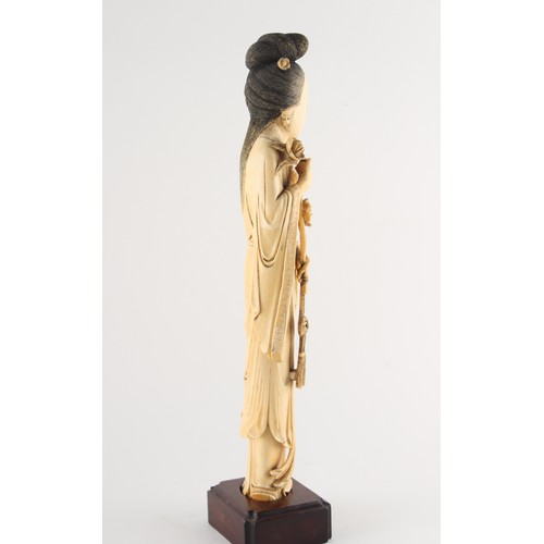 151 - Property of a gentleman - a Chinese carved ivory figure of a lady in flowing robes, 19th century, mo... 