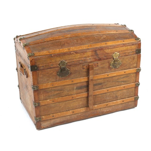 313 - Property of a deceased estate - a late 19th century tooled leather domed top trunk with fitted inter... 