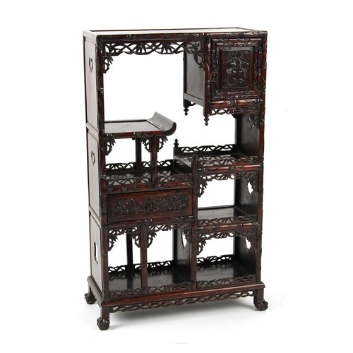 108 - A late 19th century Chinese carved hongmu display cabinet of small size, fitted with a door, a drawe... 